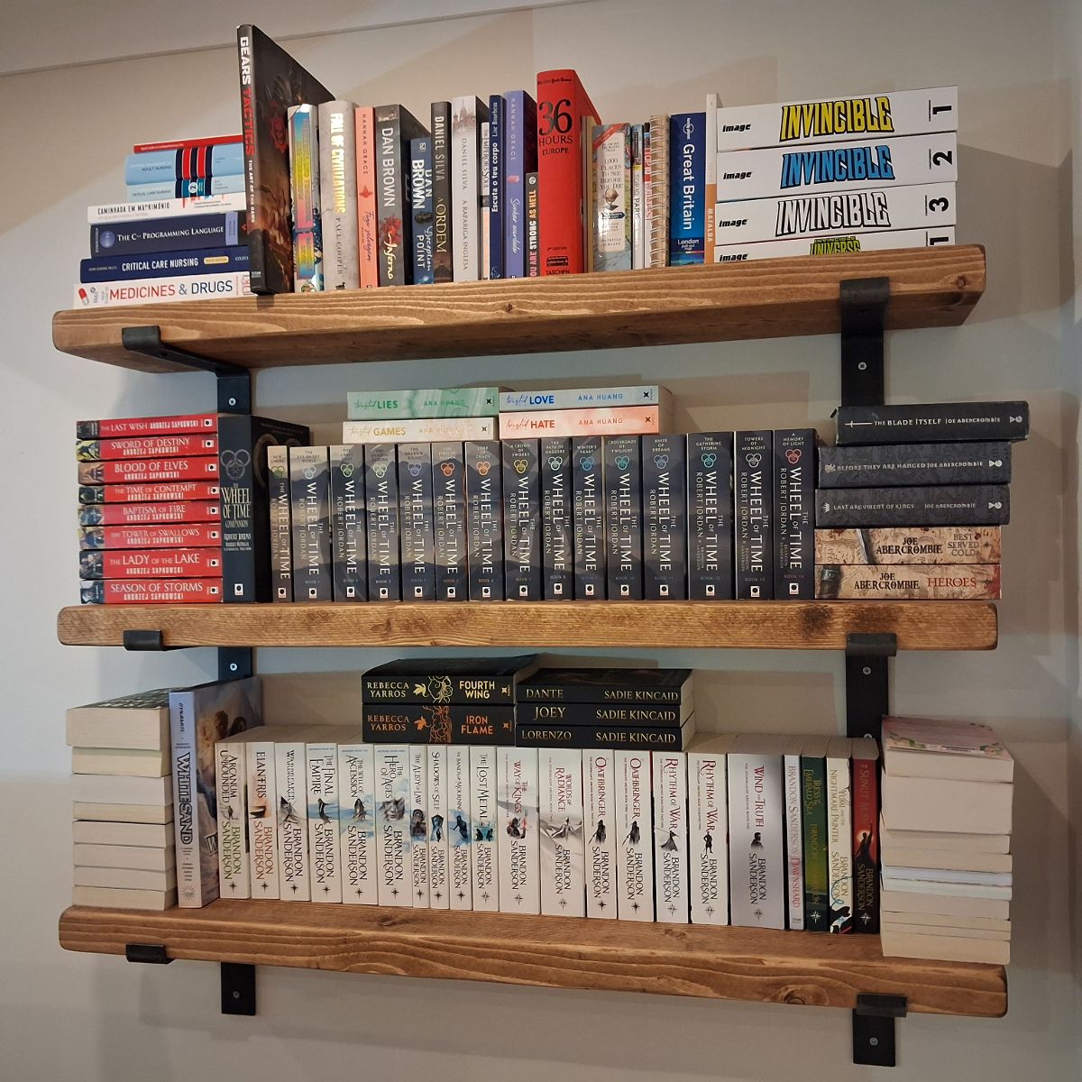 After: three timber shelves fitted and loaded with books